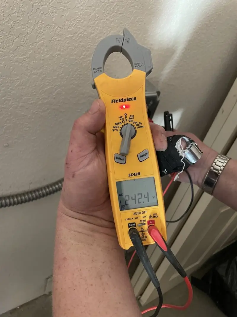 Voltage testing with clamp meter during Circuit Breaker Repair in Lenox